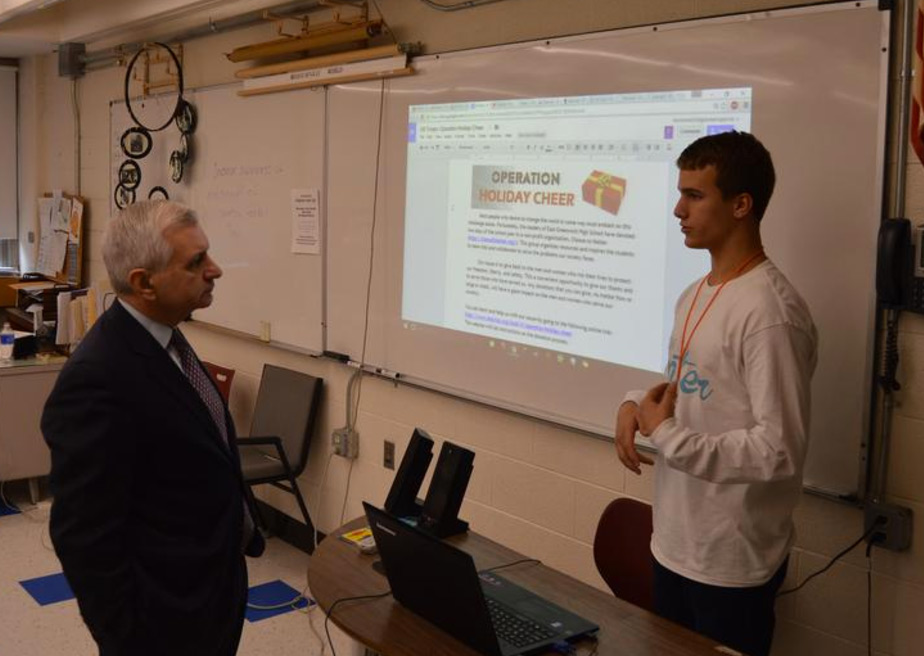 A student discusses his plan to change the world with U.S. Senator Jack Reed